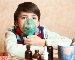 preteen boy with electric inhaler
