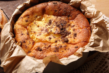 Cheesecake in bakery mold removed from the oven