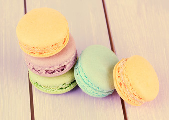 Macaroons on wooden surface close-up
