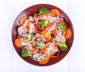 Braised wild mushrooms with vegetables and sauce in plate