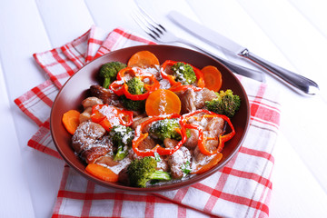 Braised wild mushrooms with vegetables and sauce in plate