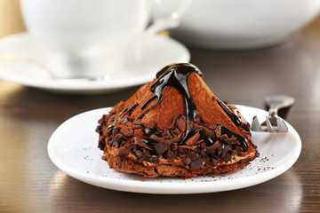 Yummy chocolate cupcake on table