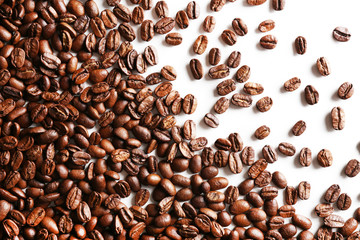 Coffee beans on white table, close-up