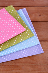 Colorful napkins on wooden table