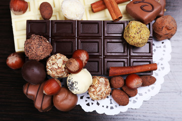 Bars of white and bitter chocolates with candies, hazelnut and