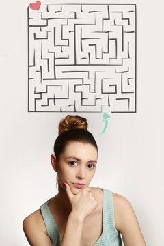 Girl with labirint above her head - finding love concept