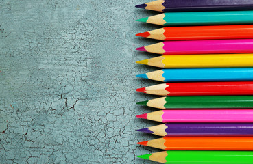Colorful pencils on texture wooden background - Powered by Adobe