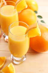 Freshly squeezed orange juice on wooden table