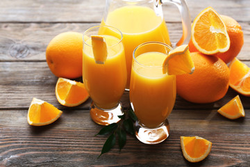 Freshly squeezed orange juice on wooden table