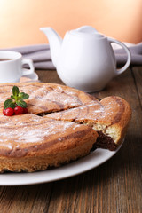 Tasty homemade pie on table