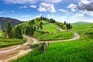 cross road on hillside meadow in mountain