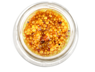 Dijon Mustard in glass jar isolated on white