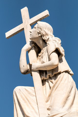 Statue of woman with Cross