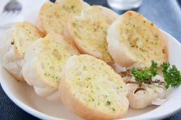 Sliced Garlic Bread in white plate