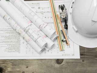 Architectural blueprint of office building with a pencil on wood