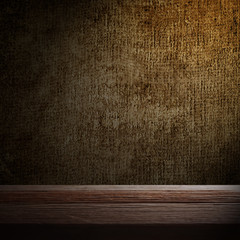 wooden desk and dark wall