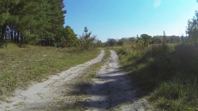 Car go  on  dirt rural road.. POV  FPV stabilized  clip