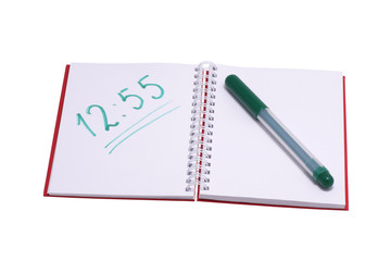 Notebook with written numbers and green felt-tip pen.