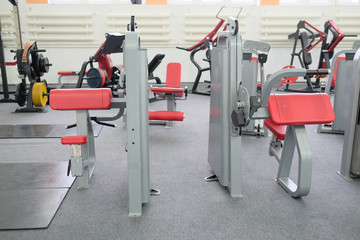 Fototapeta na wymiar Interior of new modern gym with equipment