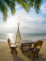 Table on the beach at dusk