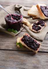 Delicious black currant jam on table close-up © Africa Studio