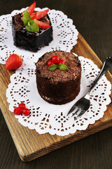 Yummy chocolate cupcake on table