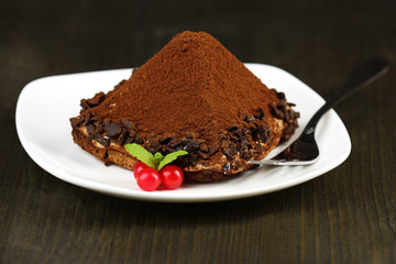 Yummy chocolate cupcake on table