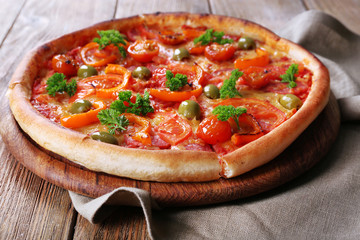 Tasty pizza with sausage and vegetables