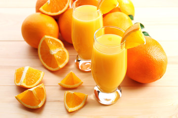 Freshly squeezed orange juice on wooden table