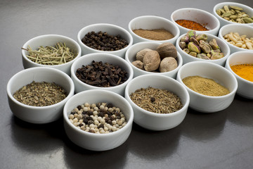 large collection of different spices and herbs isolated on Black