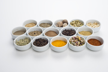 large collection of different spices and herbs isolated on white