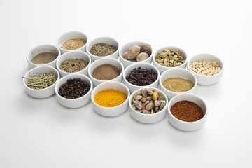 large collection of different spices and herbs isolated on white