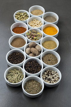 large collection of different spices and herbs isolated on Black