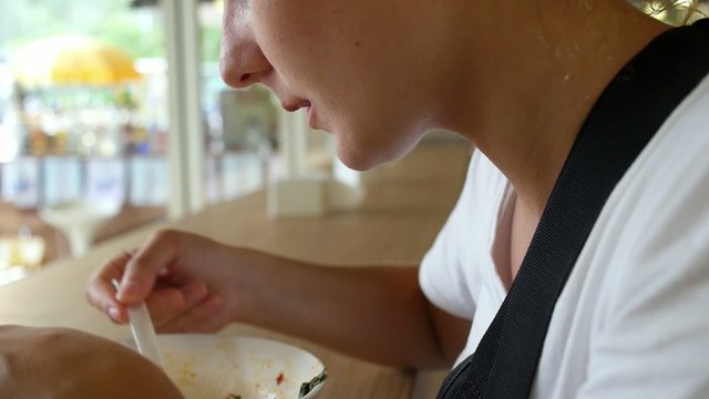 Young Female Eating Schrimp Soup, Dining in Cafe