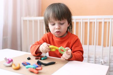 Lovely boy with playdough