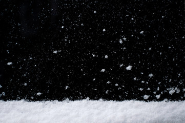 Snow on black background