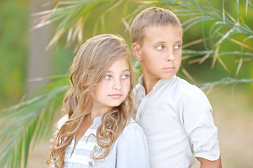Fototapeta premium Portrait of a boy girl in a summer