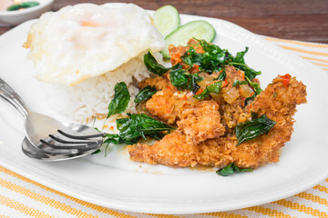 Basil fried rice with crispy chicken and fried egg (Pad kra prao