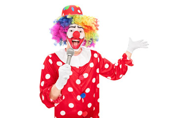 Male clown speaking on a microphone