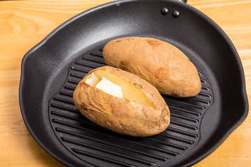 Baked Potatoes in Black Iron Skillet
