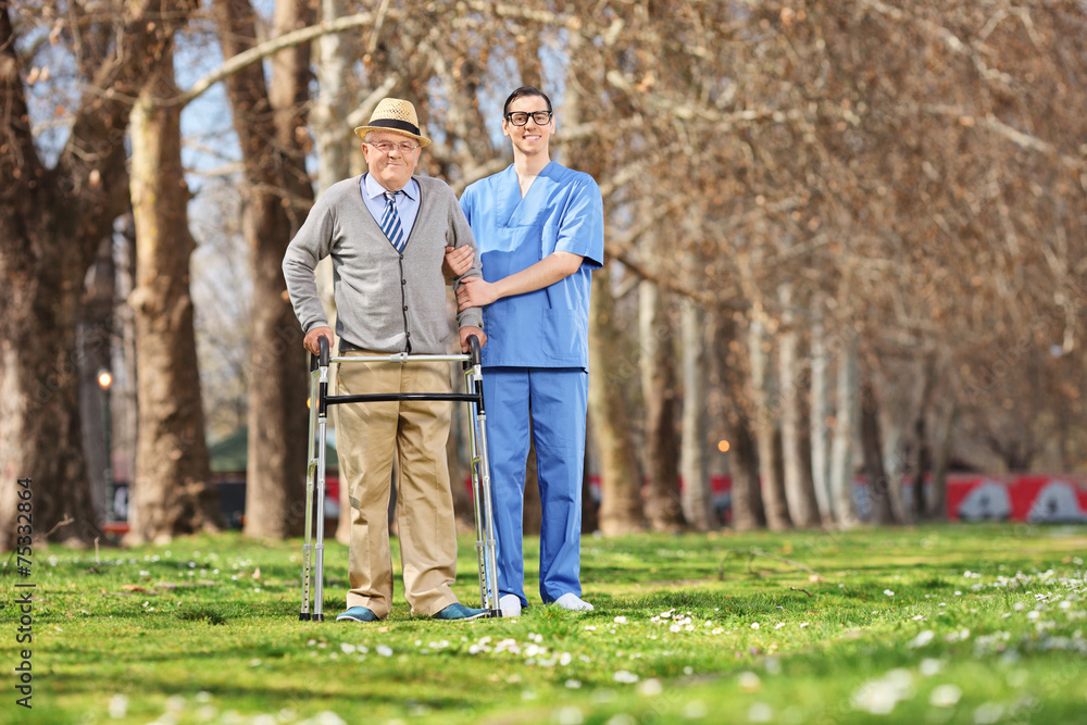 Poster medical professional and a senior posing in park