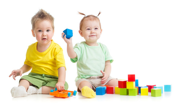 Adorable children playing colorful toys isolated