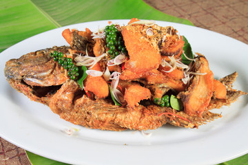 Thai food style: Fried fish toppted with chilli sauce