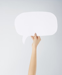 Close up of woman's hand with speech bubble