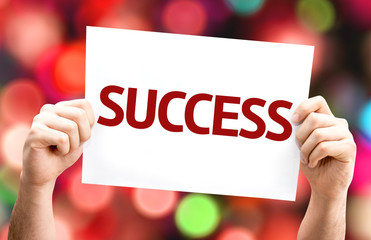 Success card with colorful background with defocused lights