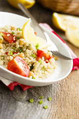 Warm quinoa salad with chickpeas and tomatoes