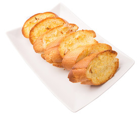 Homemade garlic bread of French baguette slices 