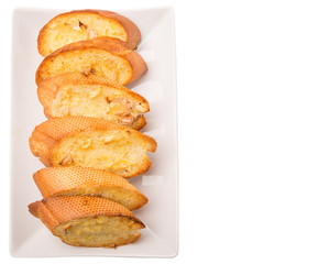 Homemade garlic bread of French baguette slices 