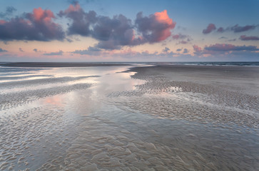 Fototapeta na wymiar low tide on North sea during sunrise