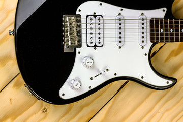 electric guitar on wooden background